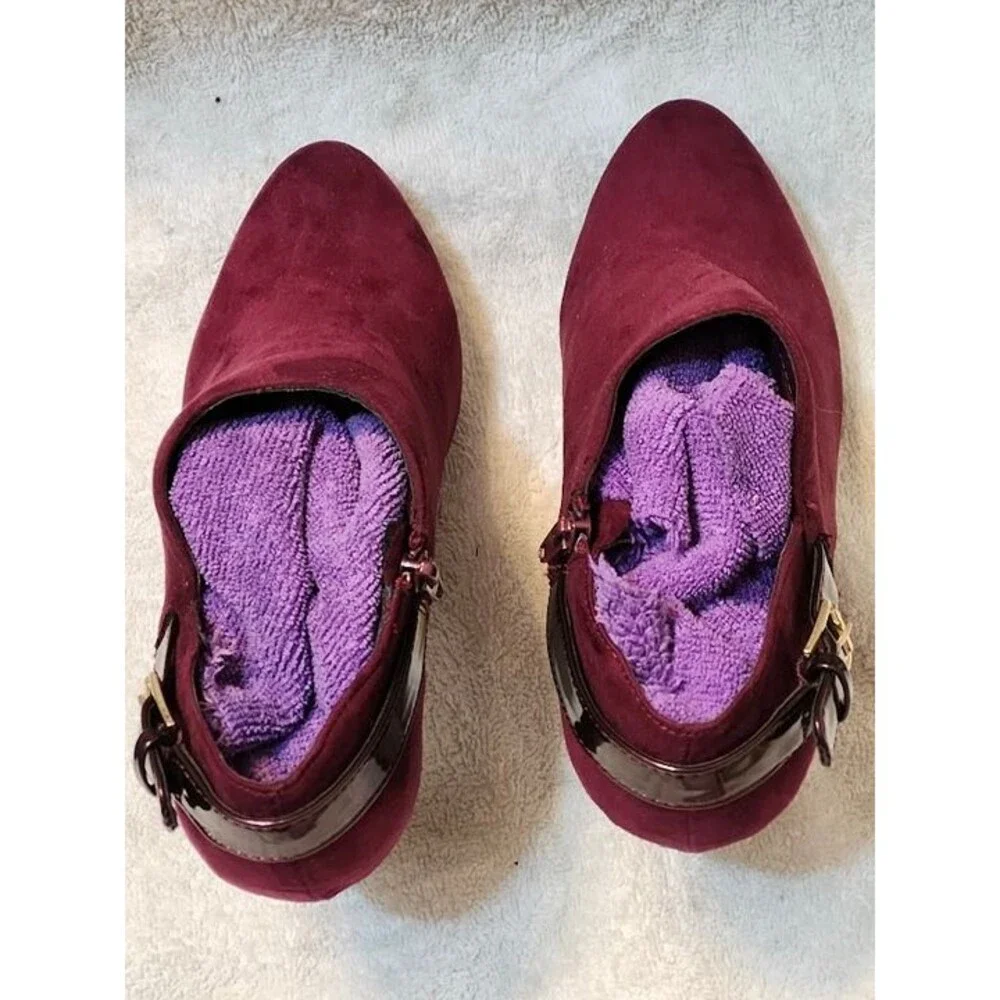 Women’s East 5th faux suede ankle booties in a rich maroon color with glossy pat